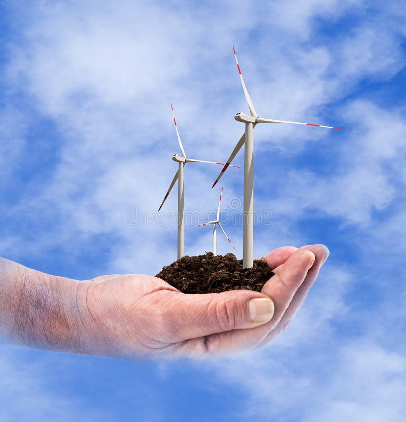 Puissance d'Eco, turbines de vent dans la main images stock Puissance d'Eco, turbines de vent dans la main images stock
