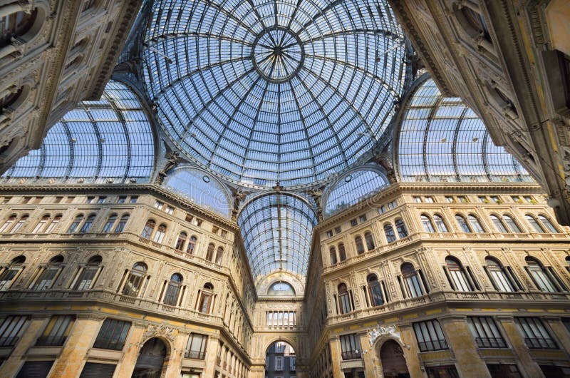 Naples, Italy, - August 19, 2013: Shopping gallery Galleria Umberto in Naples, Italy. Naples historic city center is the largest in Europe, and is listed by UNESCO as a World Heritage Site. Naples, Italy, - August 19, 2013: Shopping gallery Galleria Umberto in Naples, Italy. Naples historic city center is the largest in Europe, and is listed by UNESCO as a World Heritage Site.