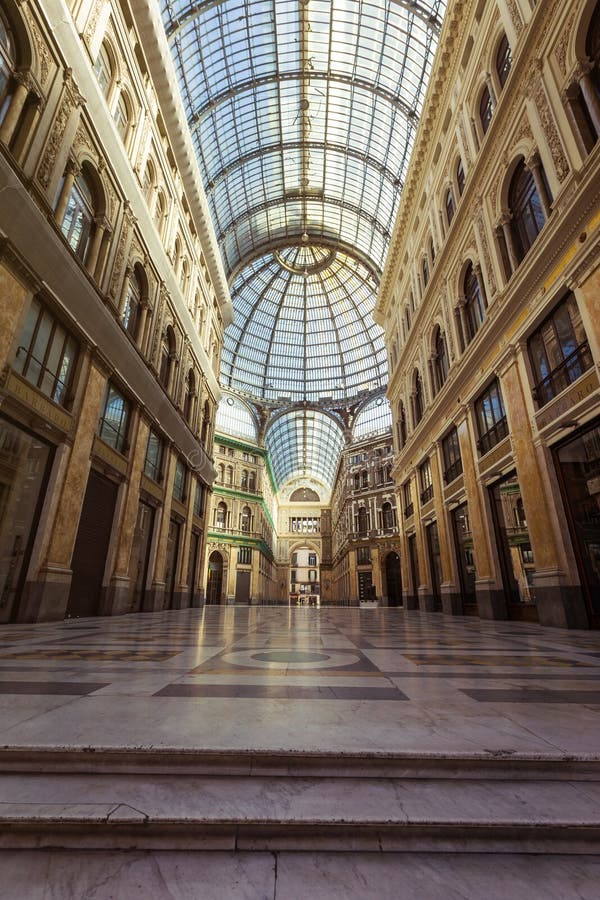 Naples, Italy - June, 2018: Shopping gallery - Galleria Umberto I in Naples, Italy. Naples, Italy - June, 2018: Shopping gallery - Galleria Umberto I in Naples, Italy