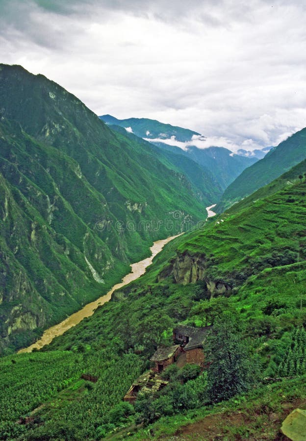Photo of aerial view of leaping tiger gorge, yunnan, china, with spectacular canyon, mountains, terraced fields and old houses. Photo of aerial view of leaping tiger gorge, yunnan, china, with spectacular canyon, mountains, terraced fields and old houses