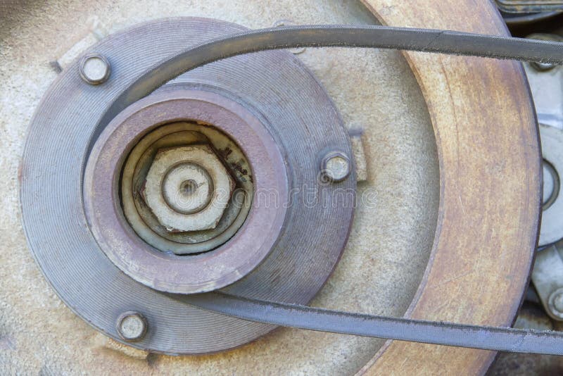 Pulley Belt of a Small Old Tractor. Stock Photo Image of metal