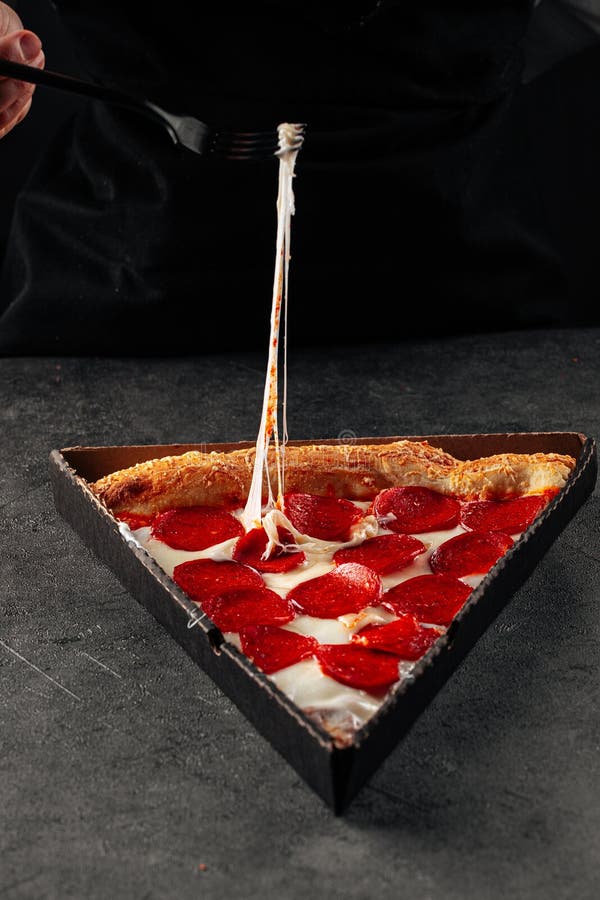 Pulling Cheese from Slice of Pepperoni Pizza Stock Photo Image of