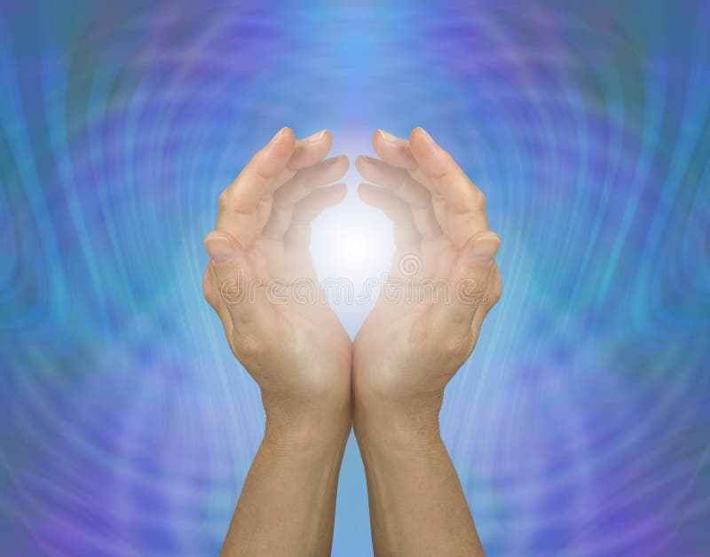 Cupped female hands embracing white healing light against a blue green energy matrix background. Cupped female hands embracing white healing light against a blue green energy matrix background