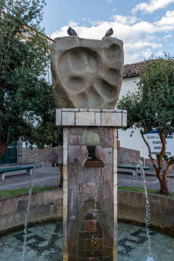 Puma paw print water fountain in Cusco, Peru. stock images