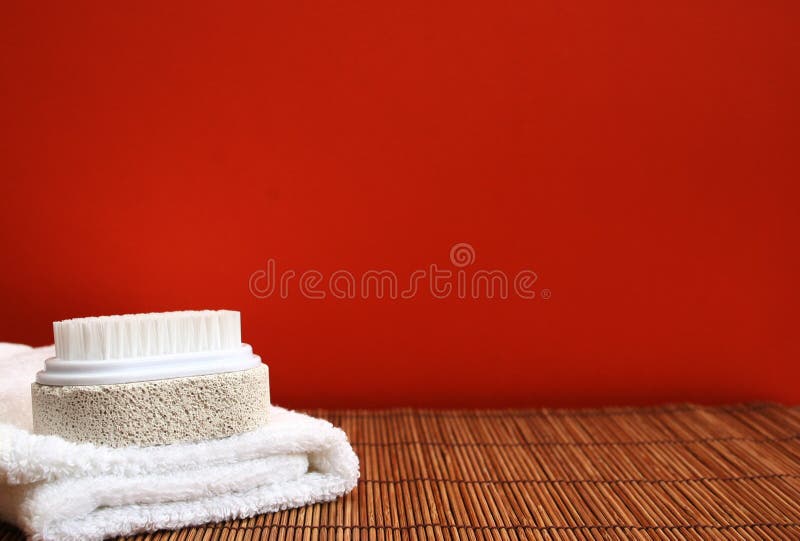 Pumice brush and towel at a spa - copy space