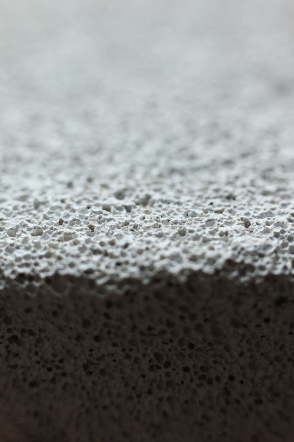 Pumice stone texture background. Macro shot of pumice stone stock image