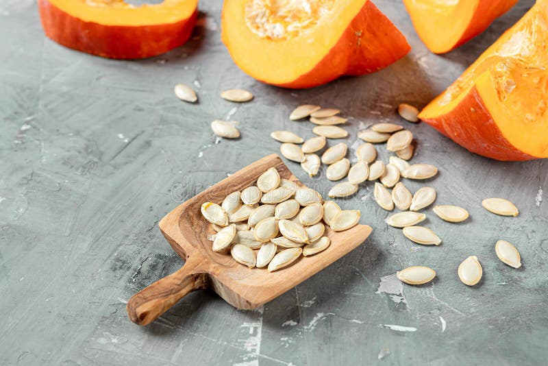 Pumkin seeds in a wooden spoon