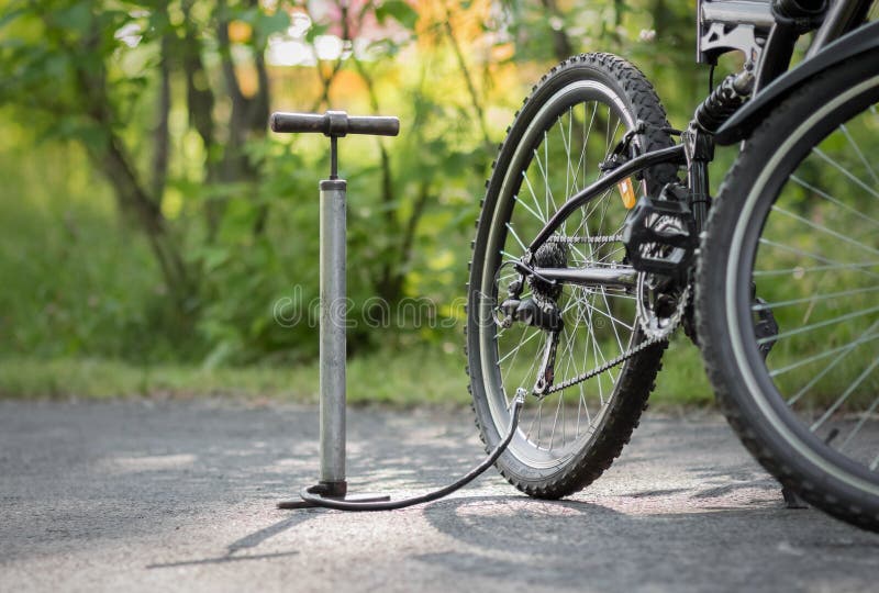A Pump and a Bicycle. Bicycle Repair in the Forest Stock Image Image