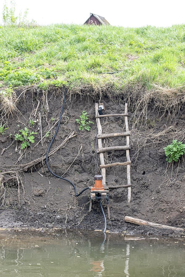 The Pump is Installed on the Bank of the River for Irrigation Stock