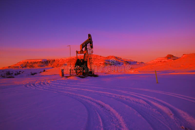 Pump jack and clouds editorial photo. Image of artesia 65517546