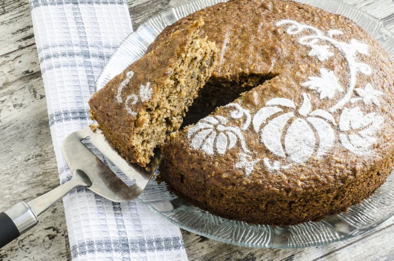 Pumpkin cake on glass plate and paddle for cake