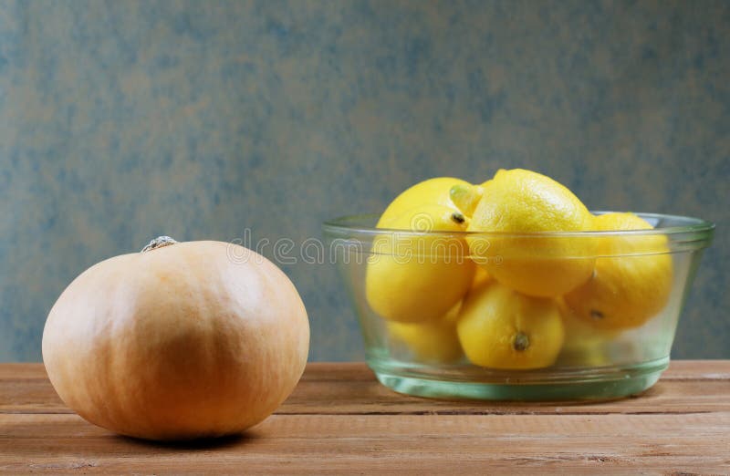 Pumpkin and a Glass Bowl of Lemons Stock Photo Image of food, citrus