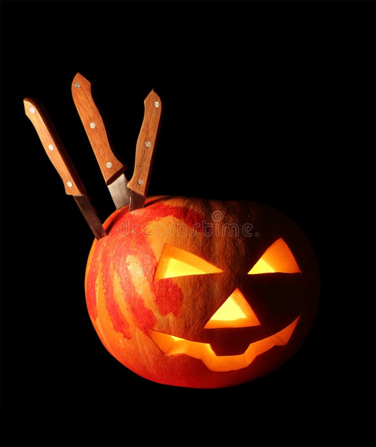 Pumpkin for Halloween isolated over black. Pumpkin for Halloween with a track of blood-stained palm and several knives isolated over black royalty free stock image Pumpkin for Halloween isolated over black. Pumpkin for Halloween with a track of blood-stained palm and several knives isolated over black royalty free stock image