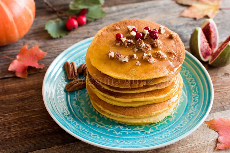 Pumpkin pancakes with pecan nuts and honey