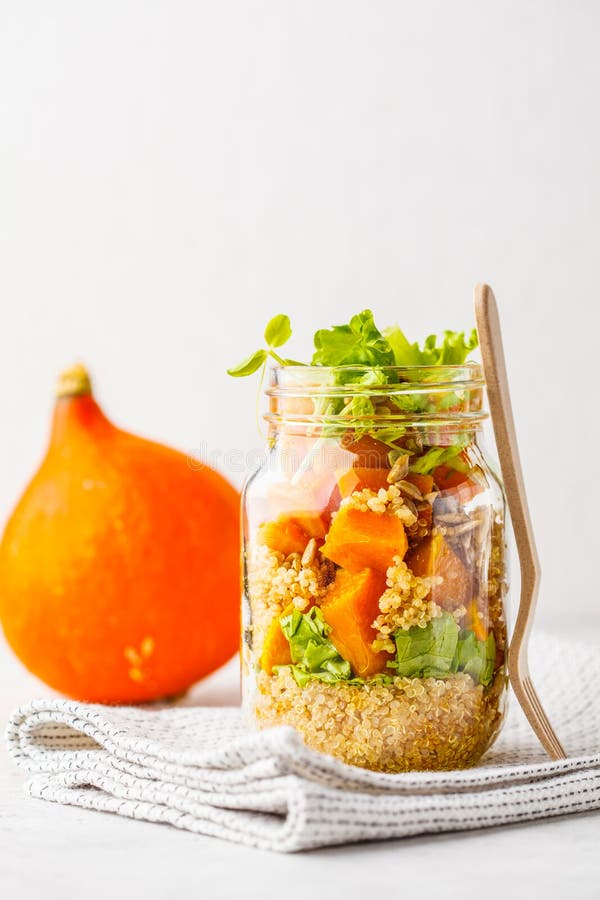 Pumpkin, quinoa salad in a jar. Vegan food concept. royalty free stock images Pumpkin, quinoa salad in a jar. Vegan food concept. royalty free stock images