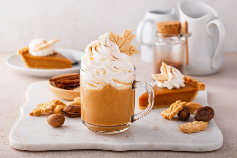 Pumpkin Spice Latte Topped with Whipped Cream and Cinnamon Stock Photo
