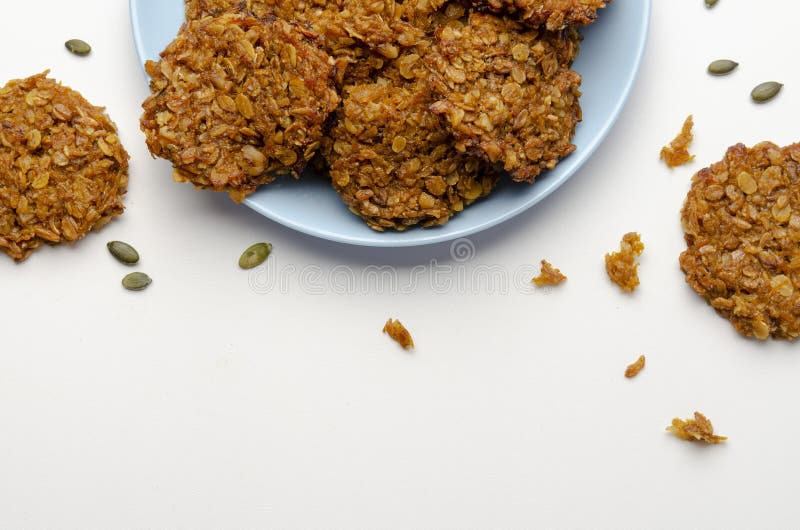 Pumpkin Vegan Oatmeal Cookies with Nuts on White Background Stock Image