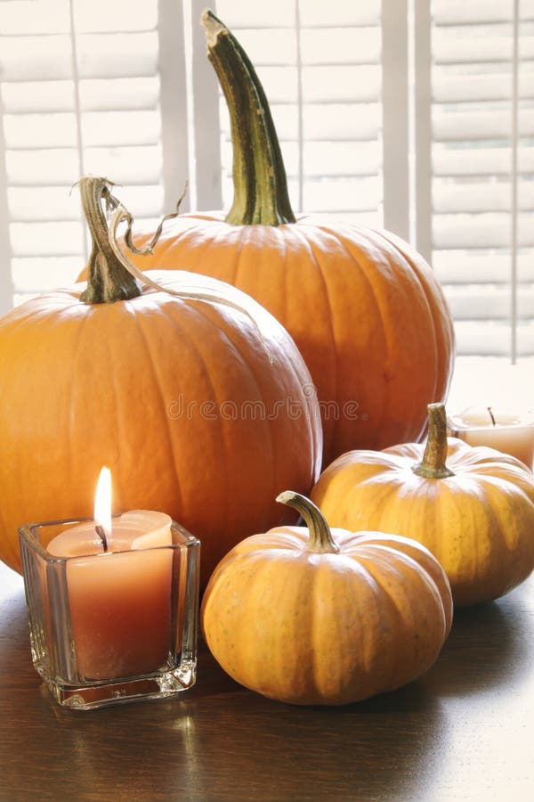 Pumpkins with Candle on Table Stock Image Image of materials, leaf