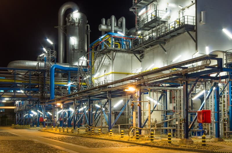 Piping system inside of industrial plant at night. Industrial lights stock images, royalty-free photos and pictures