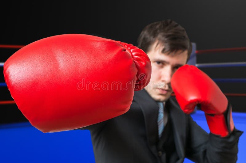 Punch of Boxing Businessman in Suit. Fighting Concept Stock Image