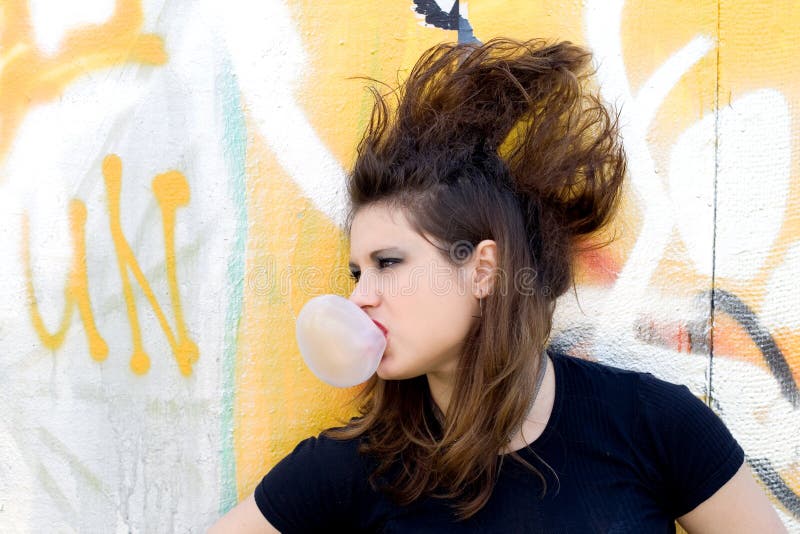 Punk girl blowing bubble gum