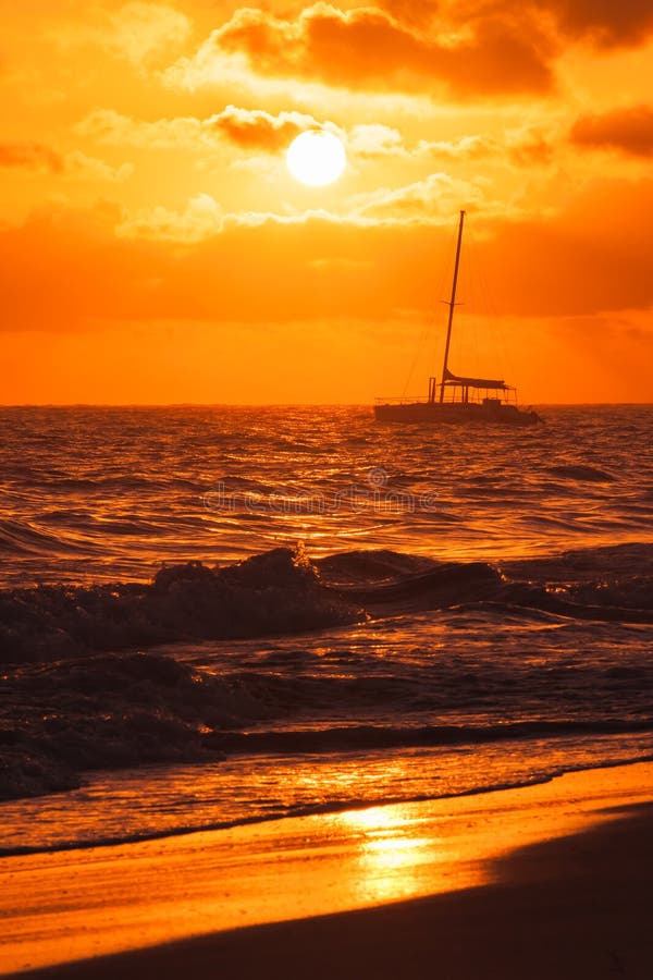 Colorful sunrise over Atlantic ocean. Dominican republic, Punta Cana beach, vertical seascape photo