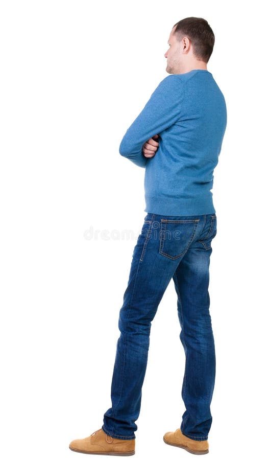 Back view of handsome man in blue pullover looking up. Standing young guy in jeans. Rear view people collection. backside view of person. Isolated over white background. The guy in the blue sweater standing sideways to the audience, with his arms crossed. Back view of handsome man in blue pullover looking up. Standing young guy in jeans. Rear view people collection. backside view of person. Isolated over white background. The guy in the blue sweater standing sideways to the audience, with his arms crossed