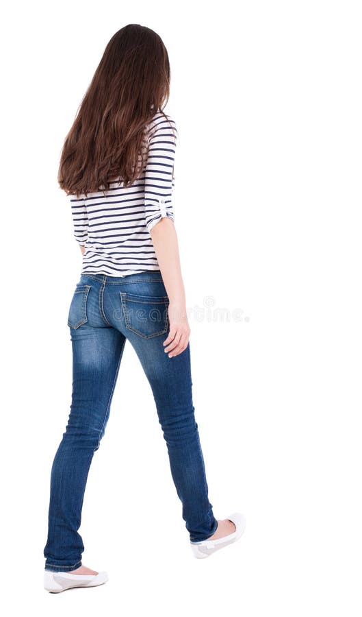 Punto di vista posteriore della donna di camminata in jeans fotografia stock libera da diritti