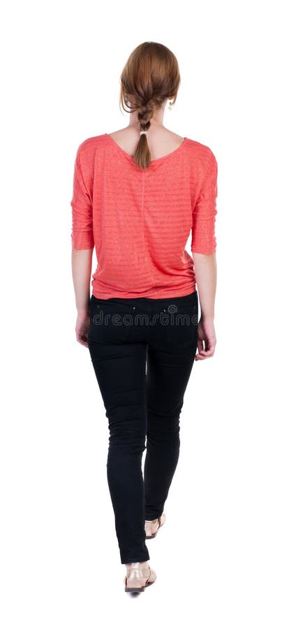 Punto di vista posteriore della donna di camminata in jeans bella ragazza bionda nella m. fotografie stock libere da diritti