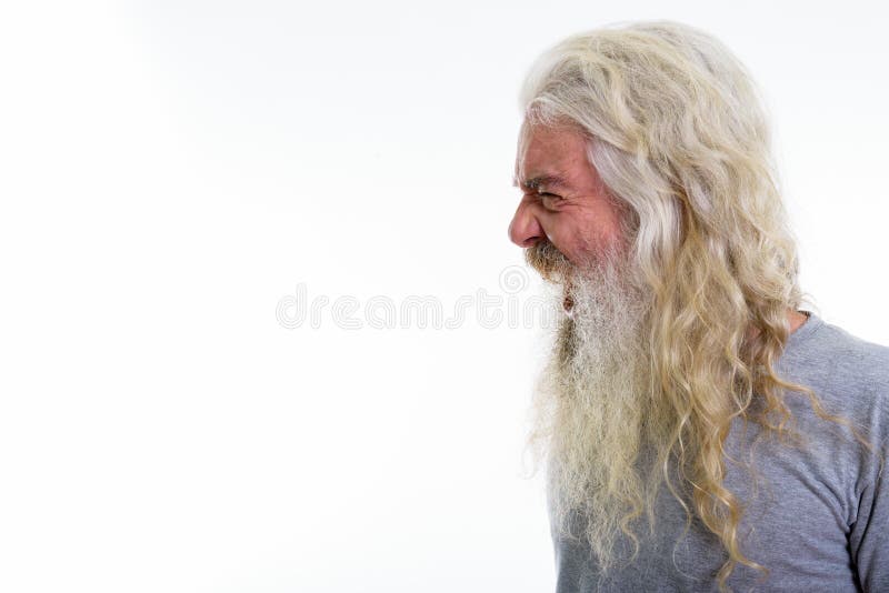 Punto di vista di profilo dell'uomo barbuto senior arrabbiato che sembra attimo furioso s immagini stock libere da diritti Punto di vista di profilo dell'uomo barbuto senior arrabbiato che sembra attimo furioso s immagini stock libere da diritti