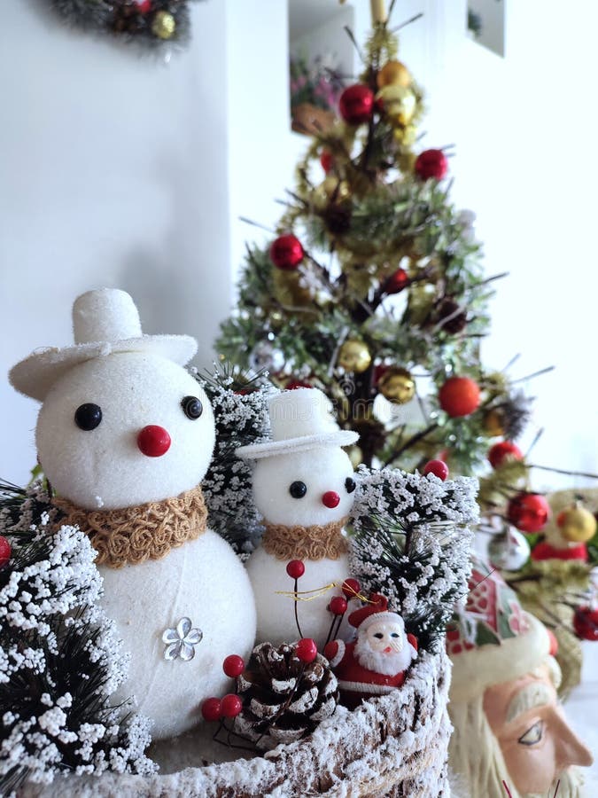 Snowman and pie tree are decorated for Christmas celebration, Christmas theme. Snowman and pie tree are decorated for Christmas celebration, Christmas theme