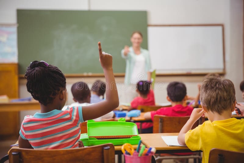 Pupils raising their hands during class stock images