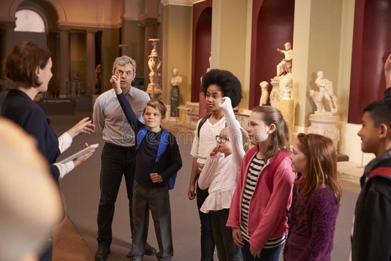 Pupils on School Field Trip To Museum Looking at Map Editorial Stock
