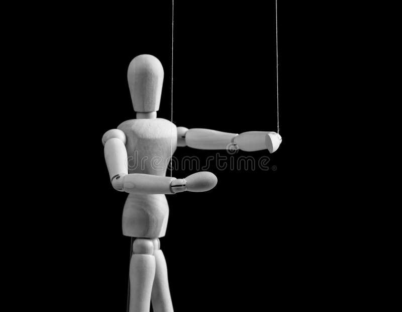 The Human Hand with Marionette on the Strings. Stock Image - Image