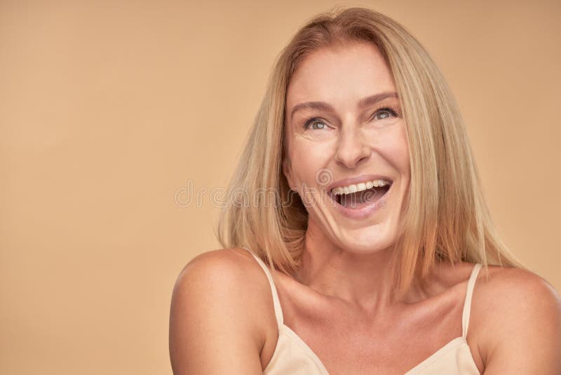 Natural Mature Blonde Woman in Underwear with Fit Body and Glowing Skin  Holding Metal Lift Anti Aging Facial Roller Stock Image - Image of contour,  mature: 222459629