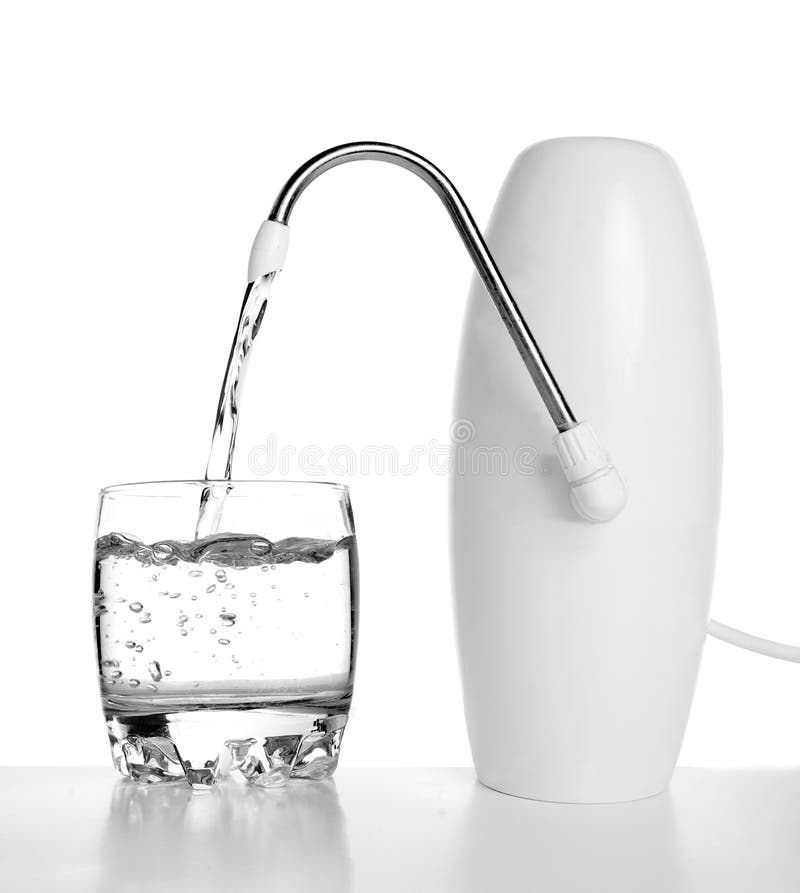 Pure water from the filter flows in a glass stock photos