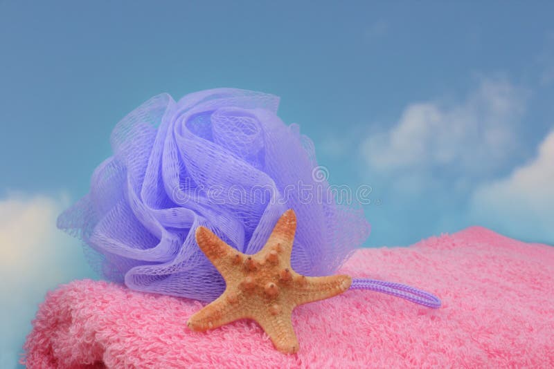 Purple Bath Pouff on Pink Towel and Starfish stock photography