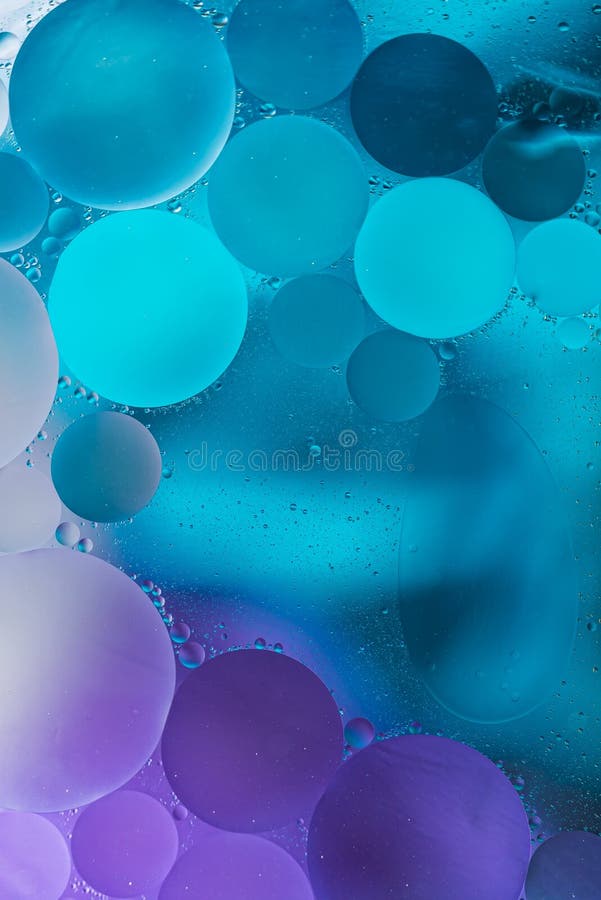 Purple, Blue Gradient Oil drops in the water -abstract background stock photography Purple, Blue Gradient Oil drops in the water -abstract background stock photography