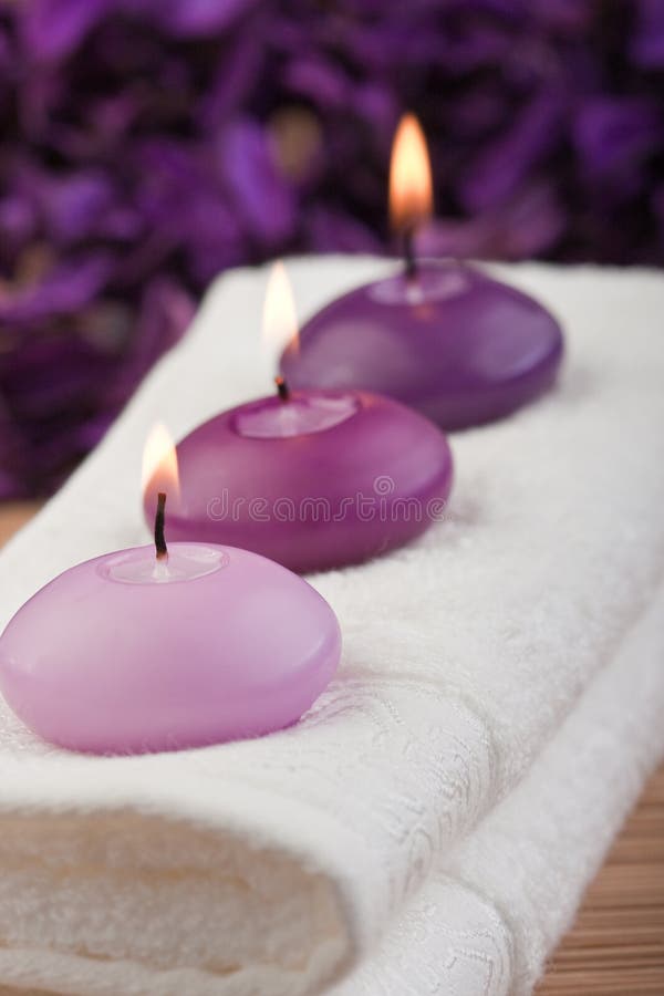 Purple candles on massage towel (2)