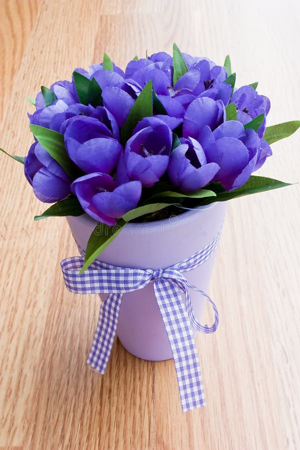 Purple flowers in a vase stock photo. Image of decoration 14012474