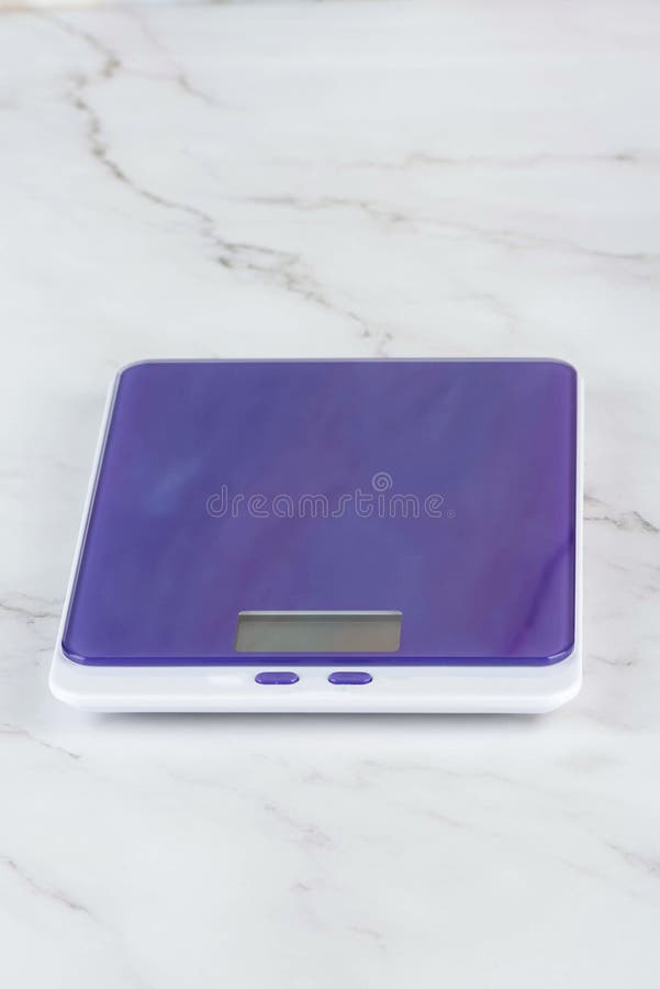 Purple Kitchen Scale on the Kitchen Table. Stock Photo Image of