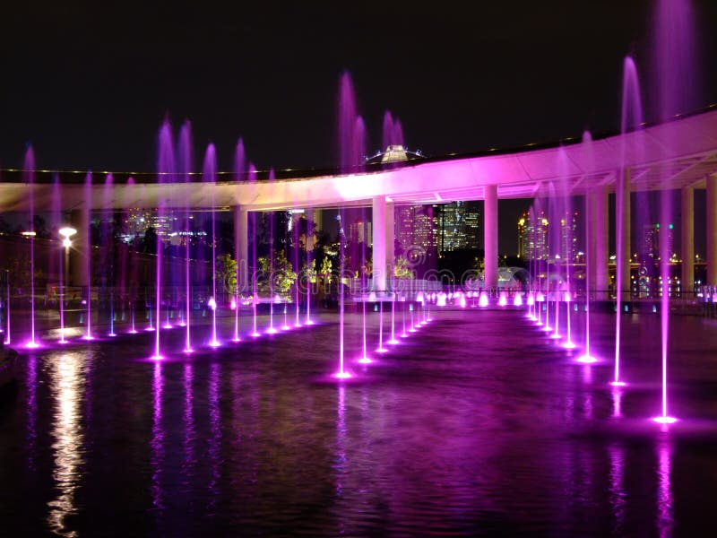 Purple-lighted water fountain at Marina Barrage