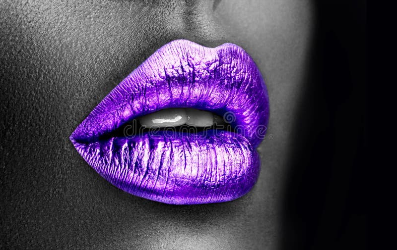 Purple lipstick closeup. Violet metal lips. Beautiful makeup. Sexy lips, bright lip gloss paint