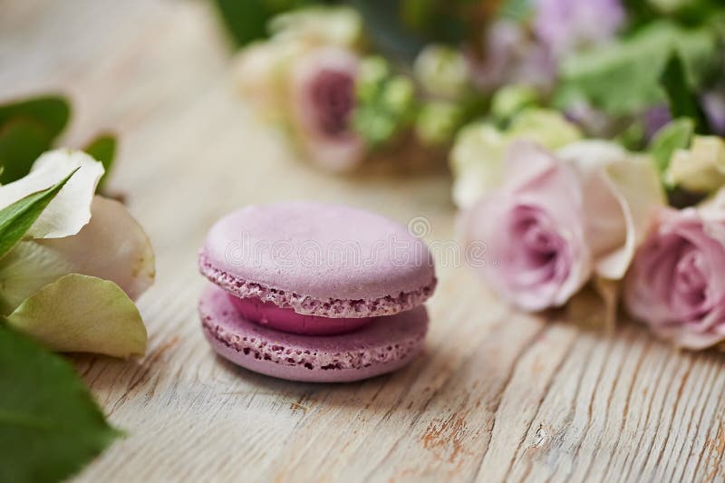 Purple macaroon cake with roses on table top royalty free stock photo Purple macaroon cake with roses on table top royalty free stock photo