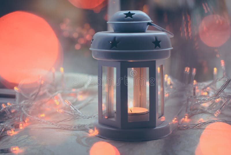Purple matte candle lantern with orange lights