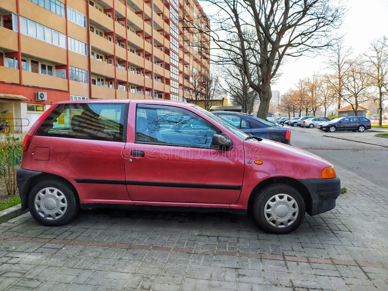 Old Red Fiat Punto Fourdoors Parked Editorial Stock Image - Image