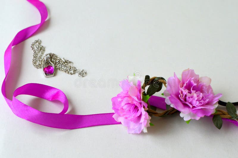 Purple ribbon and flowers stock photo. Image of pink 90452982