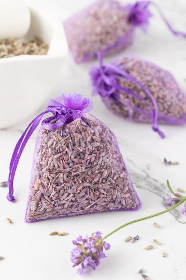 Close up of isolated bagged dried lavender blossom sacs used as moth  repellent in wardrobe for clothes protection, white background Stock Photo  - Alamy