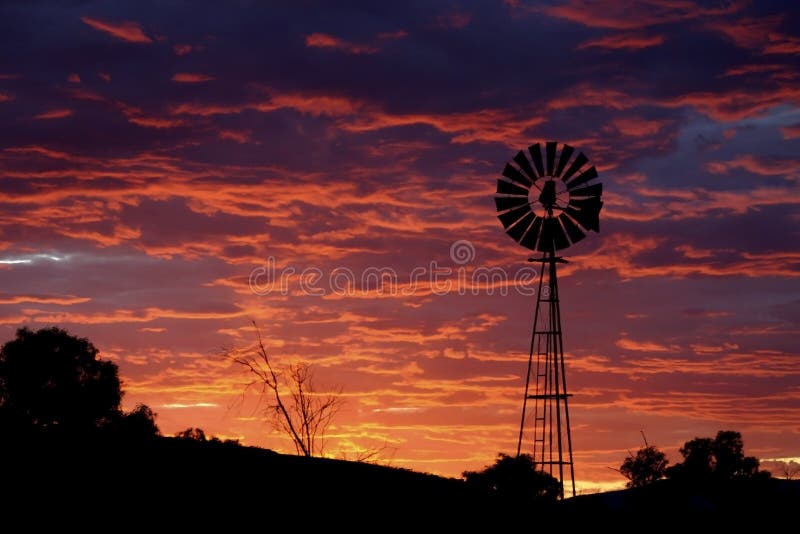 Purple sky with windmill.