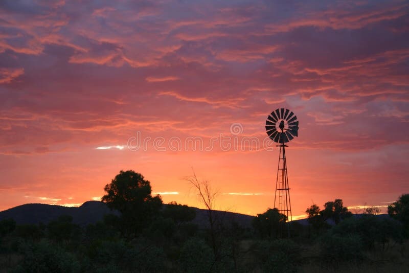 Purple sky with windmill.